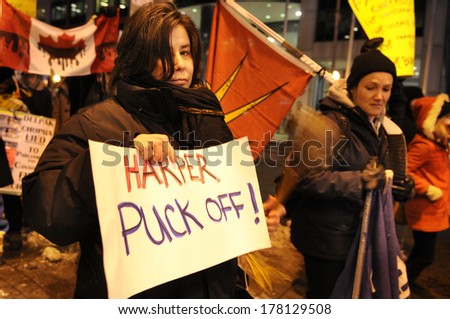 TORONTO-FEBRUARY 8: A woman with a sign almost \