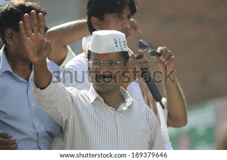 AMETHI - APRIL 20:  Arvind Kejriwal waiving hand towards local residents  during a road show in support of Amethi candidate Dr. Kumar Viswas on April 20, 2014 in Amethi ,India.