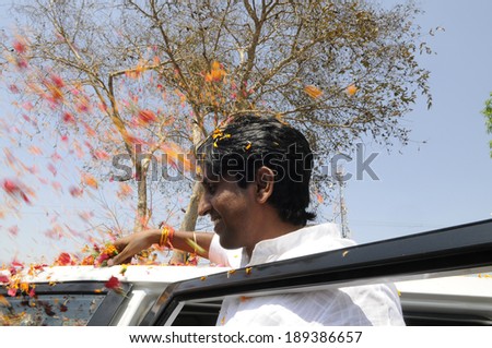 AMETHI - APRIL 21:  Dr. Kumar Viswas being showered by flowers during a road show in support of his  candidature  on April 21, 2014 in Amethi ,India.