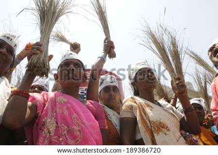 AMETHI - APRIL 21:  A group woman  AAP supporters  holding brooms during a road show in support of Amethi candidate Dr. Kumar Viswas on April 21, 2014 in Amethi ,India.