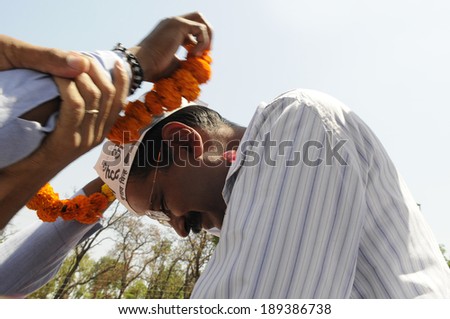 AMETHI - APRIL 21:  Arvind Kejriwal being garlanded during a road show in support of Amethi candidate Dr. Kumar Viswas on April 21, 2014 in Amethi ,India.