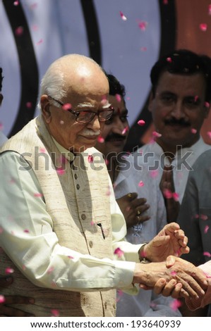 NEW DELHI-MAY 16: L.K  Advani- A senior BJP leader  being helped on to the main stage   after wining the Indian National election on May 16, 2014 in New Delhi , India.