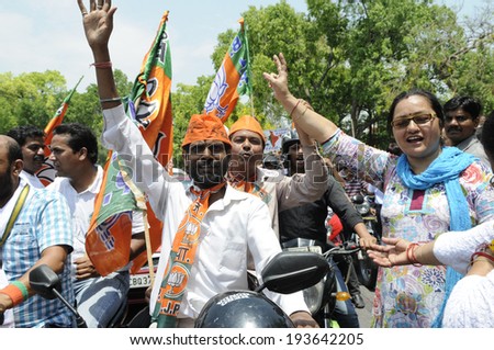 NEW DELHI-MAY 17:  BJP supporters chanting slogans during a bike rally after wining the Indian National election on May 17, 2014 in New Delhi , India.