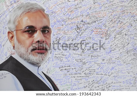 NEW DELHI-MAY 16: A message board with Indian Prime Minister Narendra Modi\'s image erected to write best wishes after wining the Indian National election on May 16, 2014 in New Delhi , India.