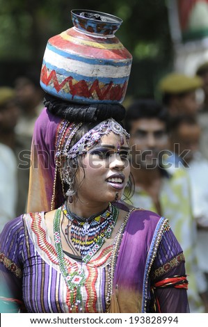 NEW DELHI-MAY 16:  A woman traditional dancer dancing to entertain the crowd  after  BJP party  won the the Indian National election on May 16, 2014 in New Delhi , India.