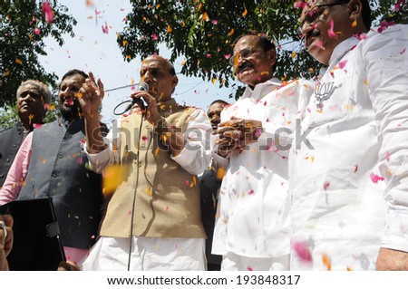 NEW DELHI-MAY 16:  BJP president Rajnath Singh along with Venkaiah Naidu and Prakash Javadekar  addressing supporters after they won the Indian National election on May 16, 2014 in New Delhi , India.