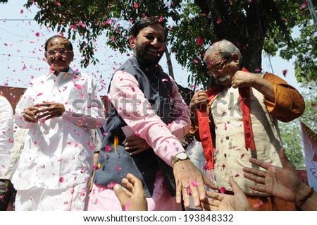 NEW DELHI-MAY 16:  Prakash Javadekar the BHP spokesperson shaking hand with the party supporters  after BJP won the Indian National election on May 16, 2014 in New Delhi , India.