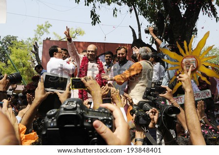 NEW DELHI-MAY 16:  BJP top leaders being congratulated and surrounded by supporters and media  after BJP won the Indian National election on May 16, 2014 in New Delhi , India.