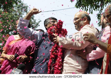 NEW DELHI-MAY 16:  Amit Shah the general secretary of the BJP  being garlanded by Ravi Shankar Prasad  after BJP won the Indian National election on May 16, 2014 in New Delhi , India.