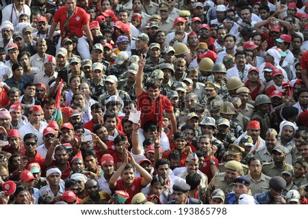 VARANASI-MAY 10: Followers of Samajwadi Party listening to speeches during an election rally of  UP Chief Minister Akhilesh Yadav  on May 10, 2014 in Varanasi , India.