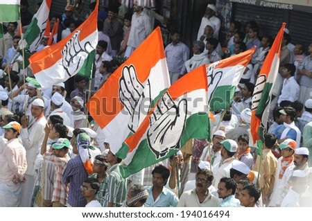 VARANASI - MAY 10: Congress party flags flying high during a road show  to support local Congress candidate Mr. Ajay Rai on May 10, 2014 in Varanasi , India.