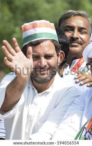 VARANASI - MAY 10: Rahul Gandhi waiving his hand during a road show  to support local Congress candidate Mr. Ajay Rai on May 10, 2014 in Varanasi , India.