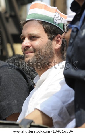 VARANASI - MAY 10: Rahul Gandhi  wearing a Congress cap during a road show  to support local Congress candidate Mr. Ajay Rai on May 10, 2014 in Varanasi , India.
