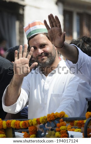 VARANASI - MAY 10: Rahul Gandhi greeting  people along the roadside who have been waiting during a road show  to support local Congress candidate Mr. Ajay Rai on May 10, 2014 in Varanasi , India.