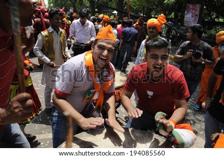 NEW DELHI-MAY 16:  BJP supporters  playing drums in front of the party headquarter  after BJP won the Indian National election on May 16, 2014 in New Delhi , India.