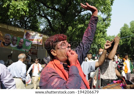 NEW DELHI-MAY 16: BJP supporters dancing and singing in front of party headquarter after BJP won the Indian National election on May 16, 2014 in New Delhi , India.