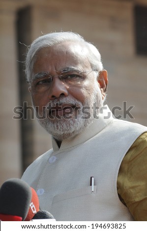 NEW DELHI-MAY 20:  Prime Minister Narendra Modi looking at the reporters at Rashtrapati Bhavan during a press conference on May 20, 2014 in New Delhi , India.