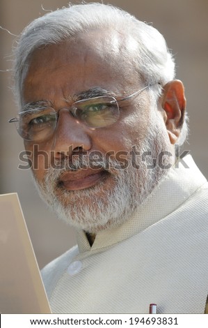 NEW DELHI-MAY 20:  Prime Minister Narendra Modi  reading an official document at Rashtrapati Bhavan during a press conference on May 20, 2014 in New Delhi , India.