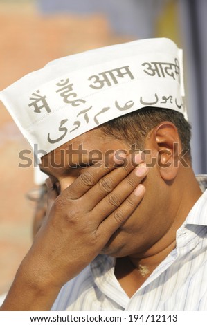 VARANASI - APRIL  27:  AAP leader  Arvind Kejriwal  with his face covered during an election rally on April 27, 2014 in Varanasi , India.