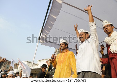 VARANASI - APRIL 27: Arvind kejriwal raising his hand with his supporters during a political meeting  on April  27, 2014 in Varanasi , India.