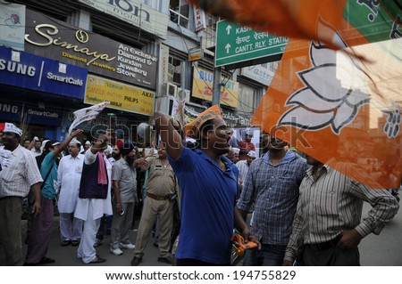 VARANASI - MAY 7: BJP supporters chanting slogans and trying to disrupt a political rally organized by AAP on May  7, 2014 in Varanasi , India.