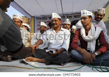 VARANASI - APRIL 27: Arvind kejriwal  shaking hand with his supporters during a political meeting  on April  27, 2014 in Varanasi , India.