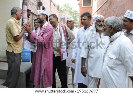 VARANASI - MAY 8: Yogendra Yadav an AAP leader talking to the voters on an early morning door to door campaign on May 8, 2014 in Varanasi , India.