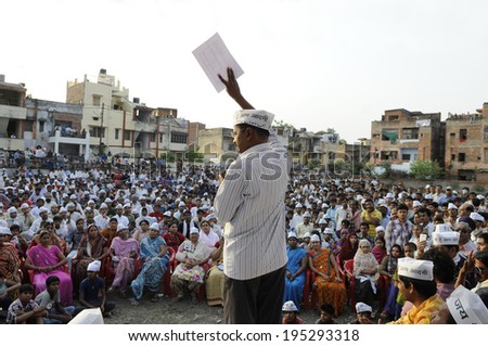 VARANASI - APRIL  27 : Arvind kejriwal showing legal documents while addressing a crowd during a political meeting on April  27 , 2014 in Varanasi , India.