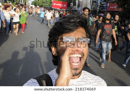 KOLKATA- SEPTEMBER 18: An angry student chanting slogans during a student protest rally organized by Jadavpur university students against police atrocities on September 18, 2014  in Kolkata, India.
