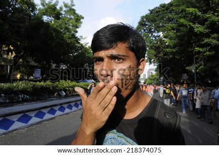 KOLKATA- SEPTEMBER 18: A student shouting  during a student protest rally organized by Jadavpur university  students against police atrocities on September 18, 2014  in Kolkata, India.