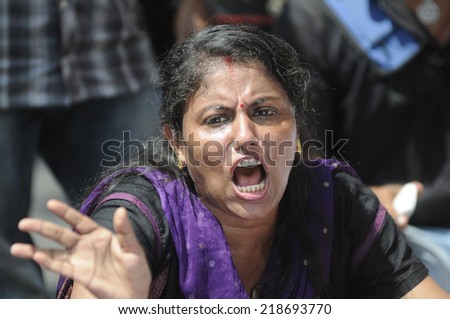 KOLKATA- SEPTEMBER 18:  An angry woman shouting slogans during a student protest rally organized by Jadavpur university students against police atrocities on September 18, 2014 in Kolkata, India.
