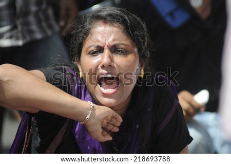 KOLKATA- SEPTEMBER 18: An angry Bengali woman shouting slogans during a student protest rally organized by Jadavpur university students against police atrocities on September 18,2014 in Kolkata,India.
