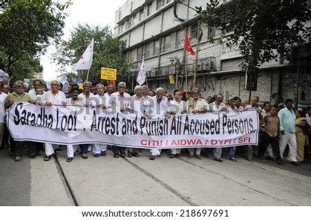 KOLKATA- SEPTEMBER 15:  Different leaders walking  in a protest rally organized to demand the arrest of the persons involved in Saradha Chit fund scandal  on September 15, 2014 in Kolkata, India.