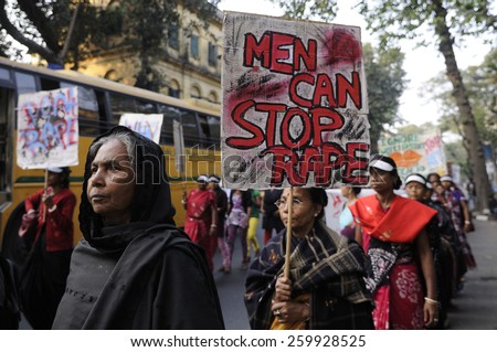 KOLKATA - DECEMBER 16 : Women of all ages with signs during a rally to remember the gang raped victim from New Delhi in the year 2012 - on December 16, 2014 in Kolkata , India.