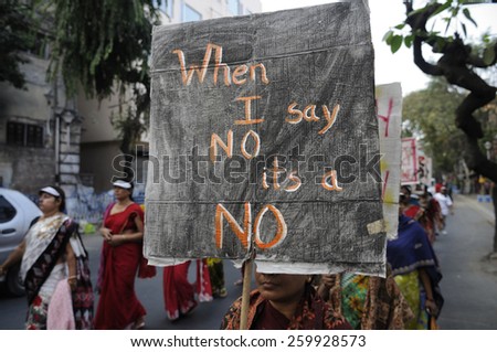 KOLKATA - DECEMBER 16 :Women with a banner emphasizing on women\'s consent  during a rally to remember the gang raped victim from New Delhi in the year 2012 - on December 16, 2014 in Kolkata , India.