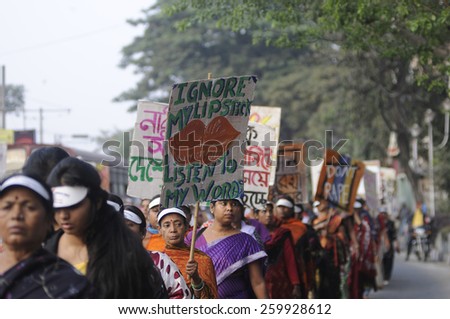 KOLKATA - DECEMBER 16 : Indian women walking on the streets  during a rally to remember the gang raped victim from New Delhi in the year 2012 - on December 16, 2014 in Kolkata , India.
