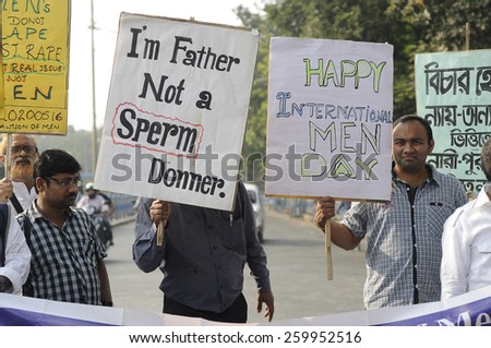 KOLKATA - NOVEMBER 15 :A man holding a sign which says \