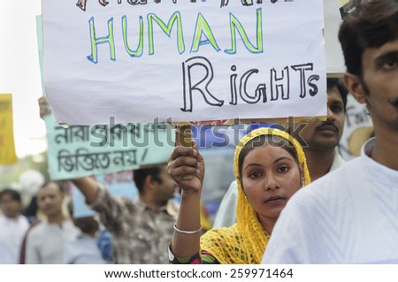 KOLKATA - NOVEMBER 15 :A Muslim girl holding pro men signs during a rally to celebrate the International Men\'s Day on November 15, 2014 in Kolkata, India.