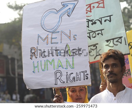KOLKATA - NOVEMBER 15 :  A man and a  muslim woman during a rally to celebrate the International Men\'s Day on November 15, 2014 in Kolkata, India.