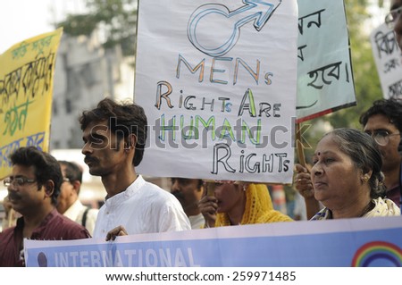 KOLKATA - NOVEMBER 15 :Men and women with signs advocating that men\'s right are human rights during a rally to celebrate the International Men\'s Day on November 15, 2014 in Kolkata, India.