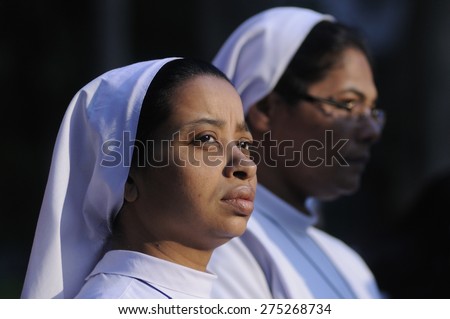 KOLKATA - MARCH 16 : Two Christian Nun with mournful looks during a candle light vigil to protest gang rape of an elderly nun on March 16, 2015, at Allen Park in Kolkata, India.
