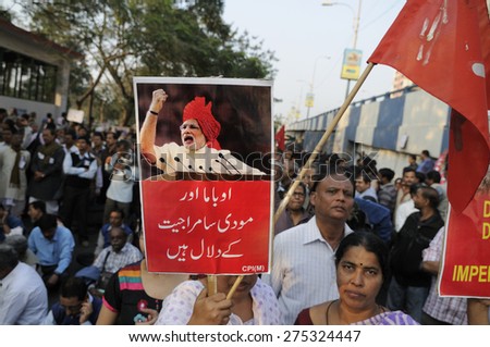 KOLKATA - JANUARY 24: Women holding anti-Modi signs to protest Obama\'s three day visit India to attend India\'s Republic Day parade on January 24, 2015 in Kolkata, India.
