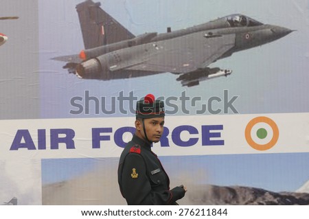 KOLKATA -JANUARY 19 : An Indian army personal standing in front of an air force tabloid during the Republic Day Parade preparation on January 19, 2015 in Kolkata, India.