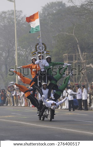 KOLKATA - JANUARY 19 :  Indian army soldiers performing motorbike stunts while carrying the Indian National flag during the Republic Day Parade preparation on January 19, 2015 in Kolkata, India.