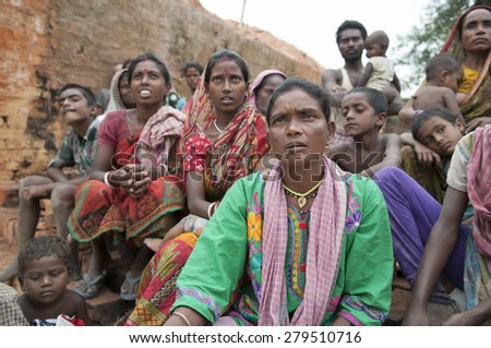 KOLKATA - OCTOBER 26 :Women workers of a brick factory sitting in a group inside a brick factory on October 26, 2014 in Kolkata , India.