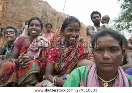 KOLKATA - OCTOBER 26 :Women workers of a brick factory in different moods while sitting in a group inside a brick factory on October 26, 2014 in Kolkata , India.