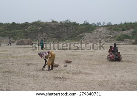 KOLKATA - OCTOBER 26 : Women workers working in a brick factory where they work for minimum wages and without any kind of social security on October 26, 2014 in Kolkata , India.