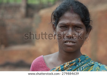 KOLKATA - OCTOBER 26 : A woman worker-one of many women working in brick manufacturing industry where they live and work under unhealthy and unsafe conditions on October 26, 2014 in Kolkata , India.