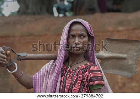 KOLKATA - OCTOBER 26 : A woman worker-one of many women working in brick manufacturing industry where they live and work under unhealthy and unsafe conditions on October 26, 2014 in Kolkata , India.