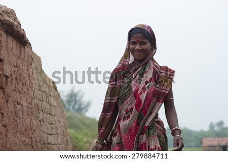 KOLKATA - OCTOBER 26 : A woman worker - one of many women working in brick manufacturing industry where they live and work under unhealthy and unsafe conditions on October 26, 2014 in Kolkata , India.